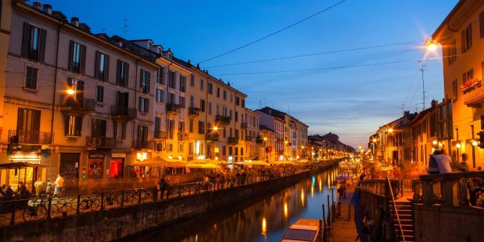 The Navigli canals of Milan lit up at night, one of the most charming experiences and top things to do in Milan in December 2025